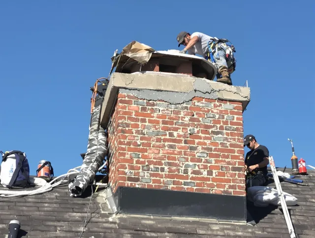 San Clemente Chimney Sweep installing a custom chimney crown in San Clemente, CA